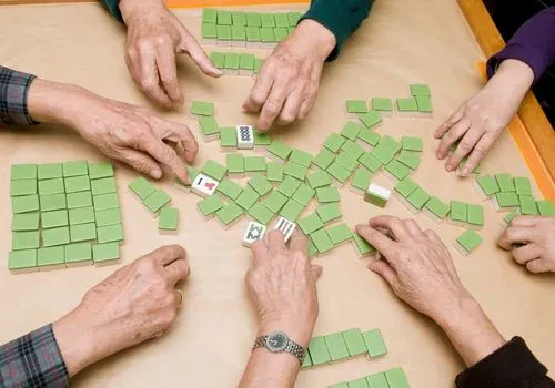 Four people playing mahjong
