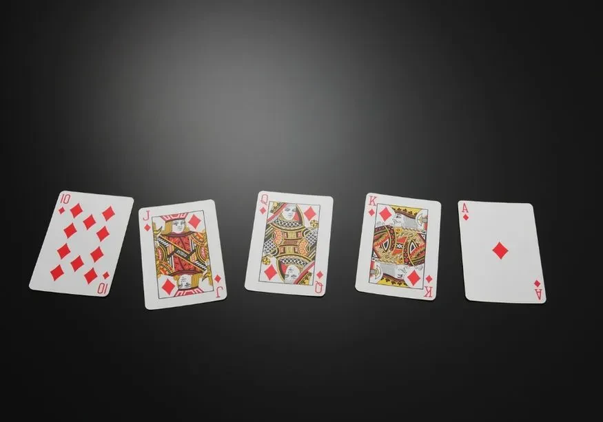 Some random cards that can be used in a game of spades laid out in a table