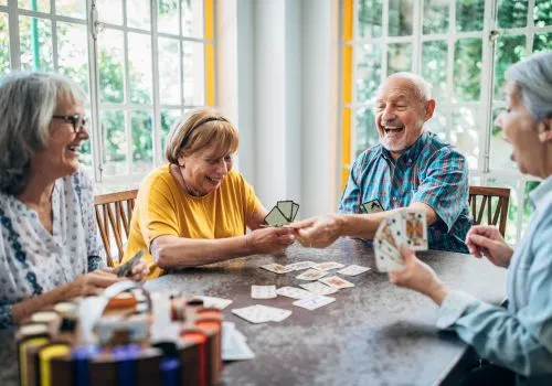 A group of nursing home residents playing some card games