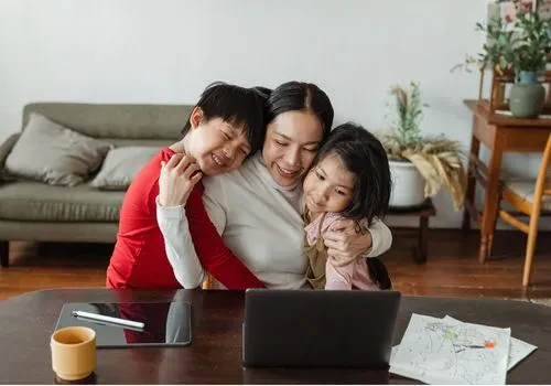 A stay-at home mom embracing two of her kids